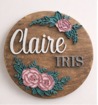 Wooden plaque with floral designs and names 